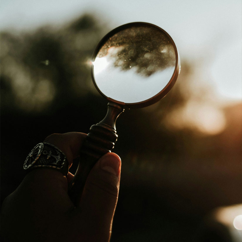 Person looking through a microscope