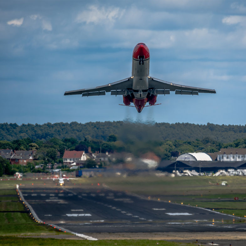 A plane taking off from Farnborough Airport